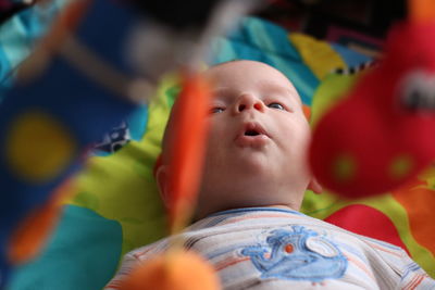 Portrait of boy lying outdoors