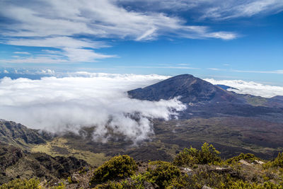 Scenic view of volcanic mountain against sky