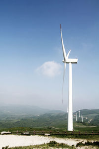 Windmill against sky