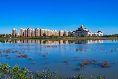 Reflection of buildings in lake