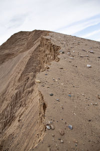 Sand dunes in desert against sky