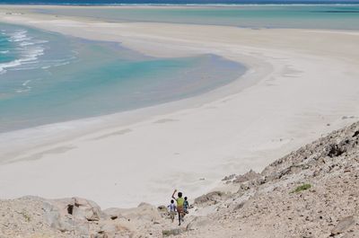High angle view of children on sand at beach