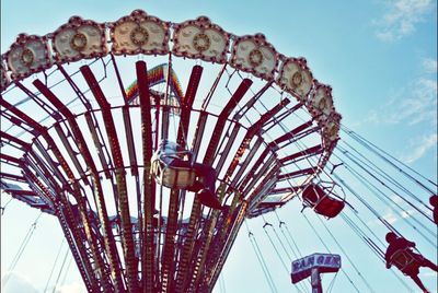Low angle view of ferris wheel against sky