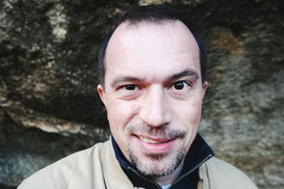 Portrait of smiling mid adult man