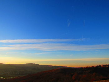 Scenic view of landscape against sky during sunset