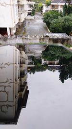 Reflection of building in puddle