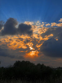 Low angle view of dramatic sky during sunset