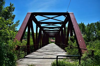 View of footbridge against sky