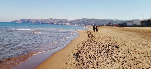 Scenic view of beach against clear sky