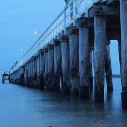 Bridge over river against clear sky