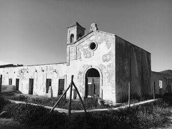 Low angle view of old building against clear sky