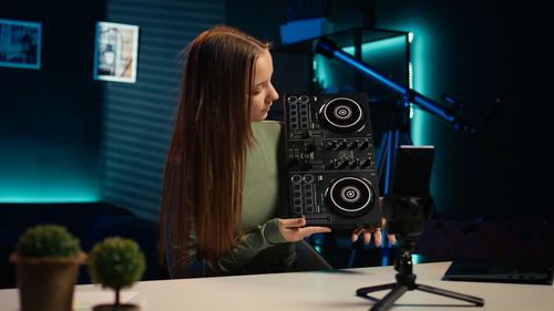 Rear view of woman using mobile phone