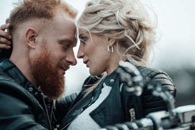 Portrait of couple kissing outdoors