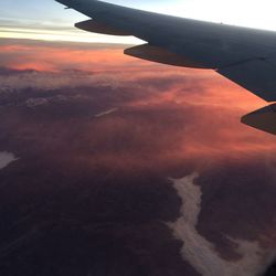 Aerial view of landscape against cloudy sky