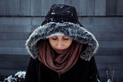 Portrait of young woman in snow