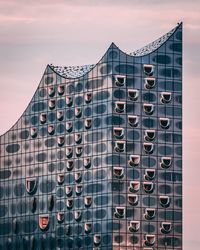 Low angle view of modern building against sky