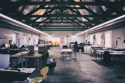 Empty chairs and tables in warehouse