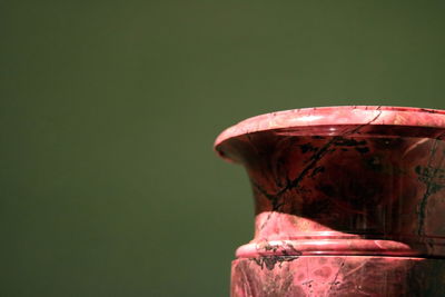 Close up of red electric lamp against wall