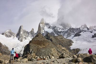 People on snowcapped mountain