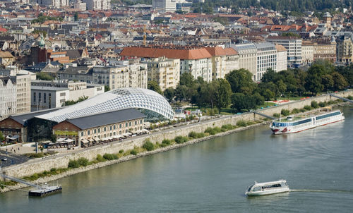 High angle view of river amidst buildings in city