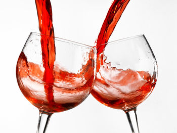 Close-up of beer glass against white background