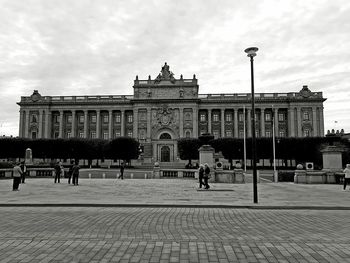 Tourists in front of historical building