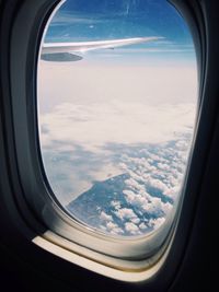 Scenic view of landscape seen through airplane window