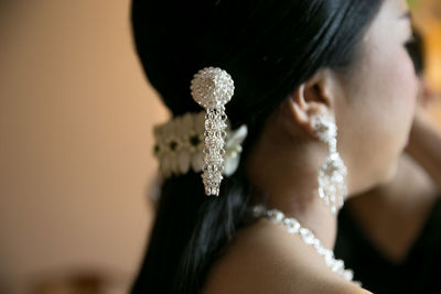 Close-up of young woman with jewellery in hair