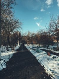 Snow covered landscape against sky