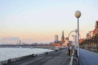 Bridge over river with city in background