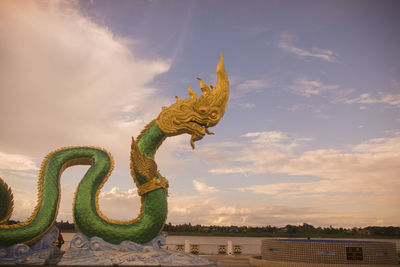 Low angle view of statue against sky