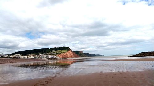 Scenic view of beach against sky