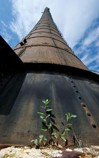 Old power house tower against cirrus sky