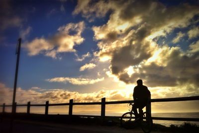 Silhouette of people at sunset