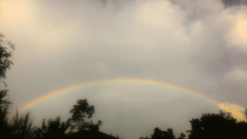 Low angle view of rainbow against sky