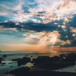 Scenic view of sea against cloudy sky