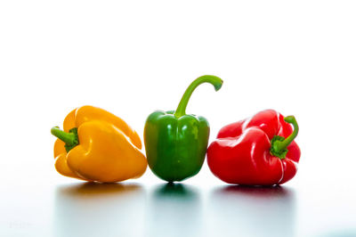 Close-up of bell peppers against white background