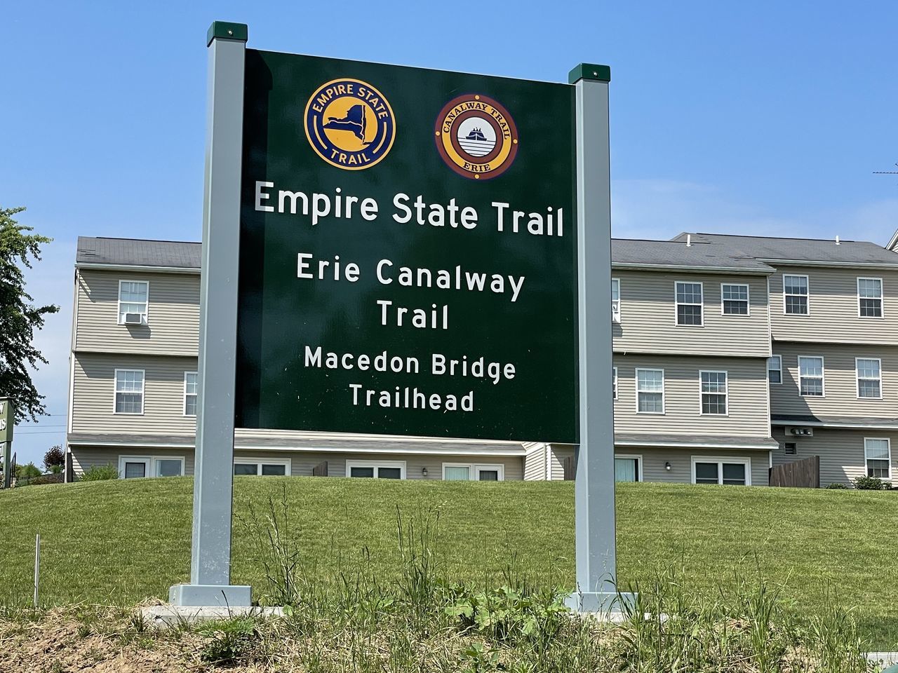 INFORMATION SIGN ON BUILT STRUCTURE AGAINST SKY