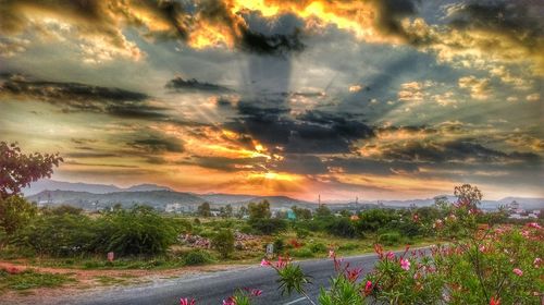 Scenic view of landscape against cloudy sky