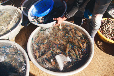 Low section of man preparing food