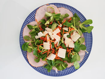 High angle view of chopped vegetables in bowl on table