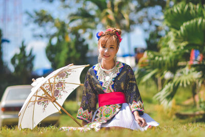 Portrait of smiling young woman outdoors