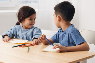 Boy working at table