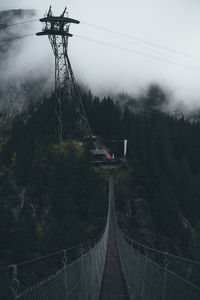 Bridge against sky during foggy weather
