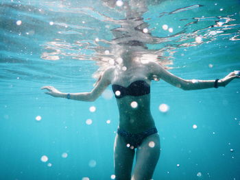 Woman swimming underwater