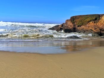 Scenic view of sea against clear sky