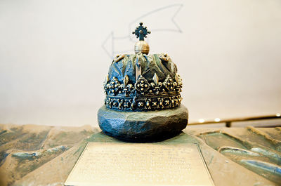 Close-up of cross on table