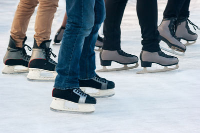 Low section of people skating on ice
