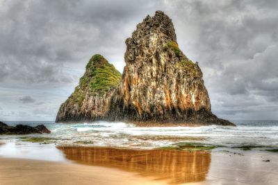 Scenic view of sea against cloudy sky