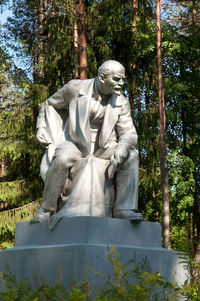 Low angle view of statue against trees